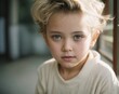© Joao - Little blonde positive boy in white casual clothes. AI Generated.