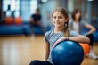 © Markus Schröder - Portrait of a concentrated kid female doing exercises with a stability ball in a gym. With generative AI technology