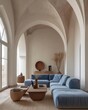 Modern minimalist interior of living room with arched ceilings, a large window, and a comfortable blue sofa. Spacious and airy room with soft natural light, featuring earth tones