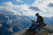 © ramona - man with laptop on mountain