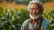 Old senior farmer Asian man is standing in a field