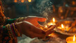 © Erik - Fortune teller tells fortunes with candles and smoke. Selective focus.