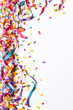 © Hype2Art - Colorful confetti and streamers on a white background.