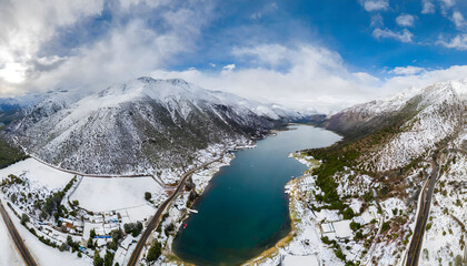 Wall Mural - lake in the winter mountains. Panoramic view snowing mountains over laguna wallpaper