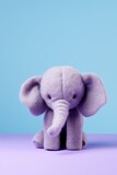 Fototapeta Zwierzęta - Purple felt plush elephant isolated