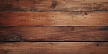 A Wooden Plank Texture With Varying Shades Of Brown.