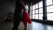 Close Up Of Young Pair Dancing Tango In Retro Room