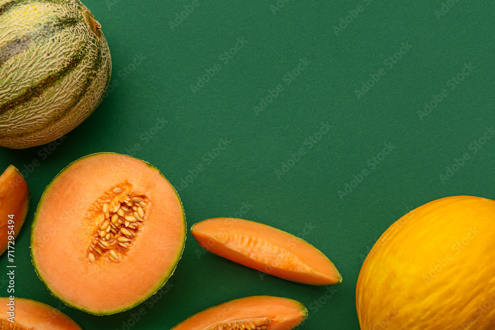 Frame made of tasty ripe melons on green background