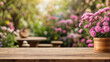 © adynue - empty wooden table for product display with aster garden background