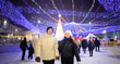 couple in love at the city fair in winter clothes and hats in winter in the city for Christmas​	