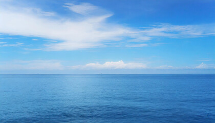  Tranquil Seascape under a Clear Blue Sky with Fluffy Clouds on a Sunny Summer Day