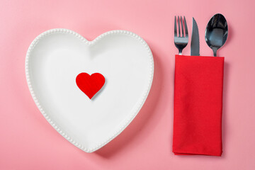 Sticker - A heart plate with a red heart and silverware of fork, knife, and spoon in a red napkin