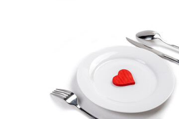 Poster - White plate with silverware of fork, knife, and spoon with red heart