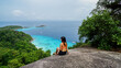 © SandyHappy - Asian female stand on viewpoint sailing rock in Similan island Koh 4 view piont. Freedom traveler woman enjoy a wonderful nature. Travel concept. View Point at Similan island. Phang Nga, Thailand.
