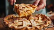 © Pixel Pine - Person lifting slice of apple pie