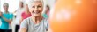 © Wolfilser - old senior woman doing sports in a gymnastics studio