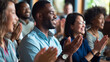 © MP Studio - Group of people applauding in a business or formal setting.