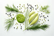 a green leaf is shown in composition with peppercorns and fennel