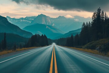 An endless road through the mountains at sunset