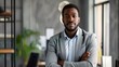 © Deb Borba - confident black businessman in office looking at camera