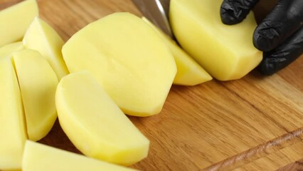 Sticker - Chef cutting raw potatoes on wooden board