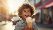 Beautiful cute young baby kid child boy model guy holding and eating a gelato ice cream in a cone outside in a city on a sunny day, 8 March, Valentine day, Birthday party, International women day