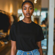Black T-shirt Mockup, Black Woman, Girl, Female, Model, Wearing a Black Tee Shirt and Blue Jeans, Oversized Blank Shirt Template, Standing in a Clothing Store, Close-up View