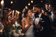 Beautiful multiethnic mix race bride and groom celebrating their wedding at an evening reception, proposing a toast to a happy marriage, surrounded by their guests.
