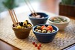 small bowls with assorted olives beside breadsticks