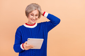 Sticker - Photo of confused puzzled woman dressed trendy blue clothes browsing website oops empty space isolated on beige color background