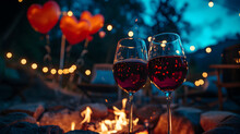 Cinematic Photograph Of Two Red Wine Glasses By A Firepit In A Camp Site. Moonlight. Stars.Heart Shaped Balloons And Confeti. Valentines. Love