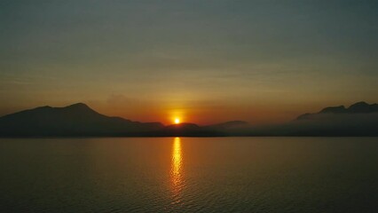 Wall Mural - Time-lapse of sunrise in the mountains above the reservoir.