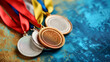 Olympic medals on blue, symbolizing sports achievements. Gold, silver, and bronze medals for Olympic champions. Set of Olympic medals ready for winning athletes