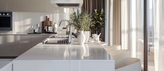 Canvas Print - The camera zoomed in, capturing a close view of the white stylish kitchen with a cooking island, nestled within the luxurious interior of a modern apartment adorned in light colors and furnished with