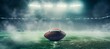 american football ball on the grass with blurred stadium  lights in the background, horizontal wallpaper or banner, large copy space for text. sport,  show and big game concept 
