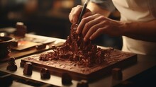 A High-definition Image Of A French Chocolatier's Hands Expertly Crafting A Delicate Chocolate Sculpture. Highlight The Precision And Artistry Involved In The Process.
