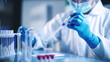© Inlovehem - Doctor using blood test tube to prevent virus in laboratory
