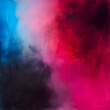 Abstract background with a gradient of red, pink, blue, and black showcasing an artistic and textured color blend.