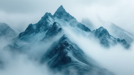 Sticker -  a very tall mountain covered in snow in the middle of a foggy day with low lying clouds in the foreground and low lying clouds in the foreground.