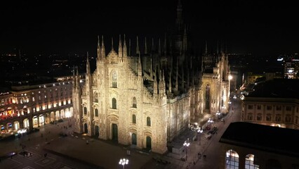 Wall Mural - EUROPE, ITALY, MILAN 01-24-2024 Milan  Cathedral Piazza Duomo by night drone aerial view - sightseeing and tourist attraction in downtown of the fashion city - new skyline 