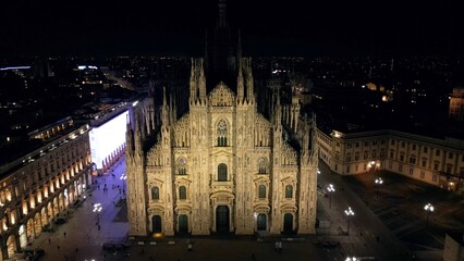 Wall Mural - EUROPE, ITALY, MILAN 01-24-2024 Milan  Cathedral Piazza Duomo by night drone aerial view - sightseeing and tourist attraction in downtown of the fashion city - new skyline 