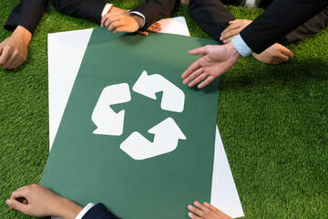 Recycle icon on meeting table in office with business people planning eco business investment on waste management as recycle reduce reuse concept for clean ecosystem. Quaint