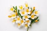 Fototapeta Tulipany -  a bouquet of white and yellow flowers on a white background, top view, flat lay on a white surface, with space for text or a place for your own text.