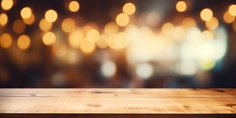 Wall Mural - Wooden table with blurry coffee shop background and bokeh light for product display.