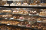 Fototapeta Boho -  bakery store with a variety of cupcakes. showcase of bakery with muffines