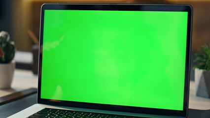 Wall Mural - freelancer speaking green screen laptop at workplace. manager talking computer