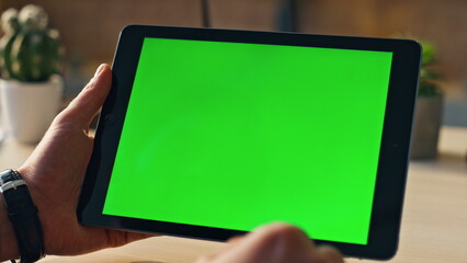 Wall Mural - hands touching mockup tablet searching information in internet indoors close up.