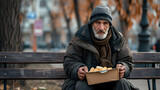 Fototapeta  - Homeless poor man eating on the street