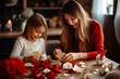 © tatsiana502 - Mom and daughter making a paper craft at home, in red and white clothes,