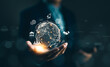 © Supatman - Businessman holding globe virtual on hand with business icons. Global internet connection application technology and digital marketing. Market link tech, internet of things, Big data tools, financial,